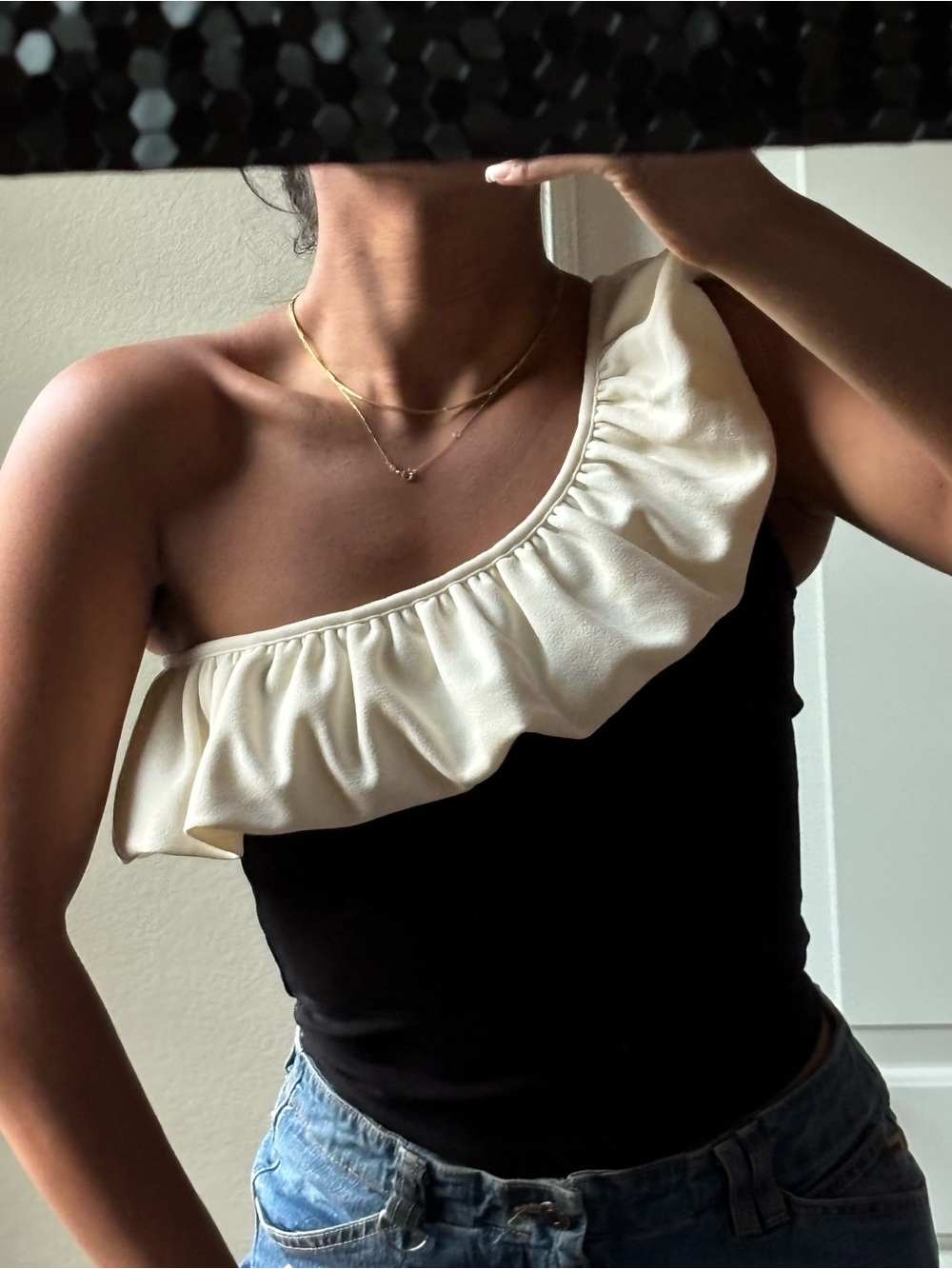 Elegant Black and Cream One-Shoulder Top